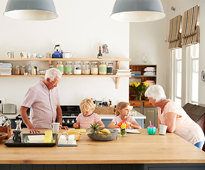 grandparents at kitchen island with grandkids fixed indexed annuities oregon