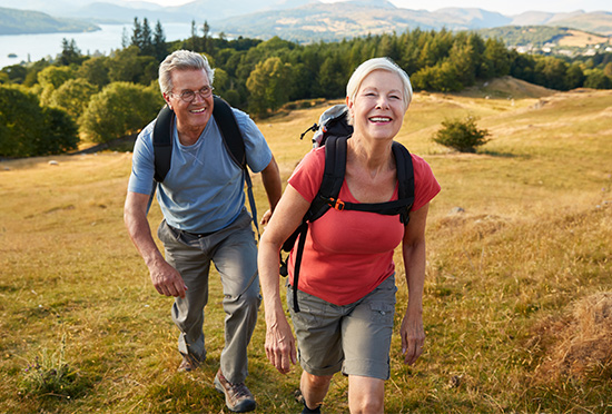 smiling seniors hiking retirement planning oregon
